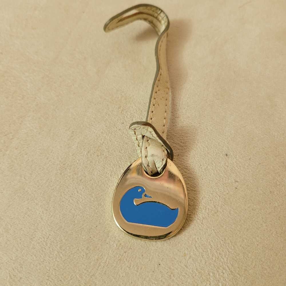 Dooney Bourke Duck Emblem on Leather Hang Strap